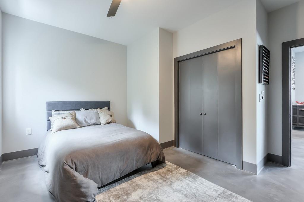 702 Joe Lane Cox Road, Unit 203 Dawsonville, GA 30534 - Photo 53 of 60 a bedroom with a bed and a dresser