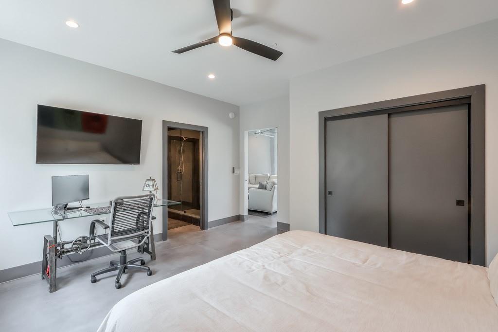 702 Joe Lane Cox Road, Unit 203 Dawsonville, GA 30534 - Photo 57 of 60 a bedroom with a bed and a flat screen tv