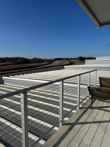 a view of a terrace with wooden floor and seating space