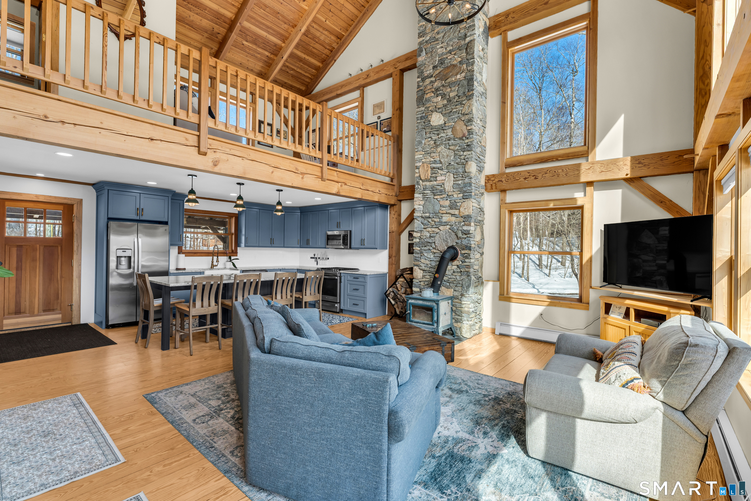 167 Round Hill Road Salem, CT 06420 - Photo 12 of 48 a living room with fireplace furniture and a flat screen tv