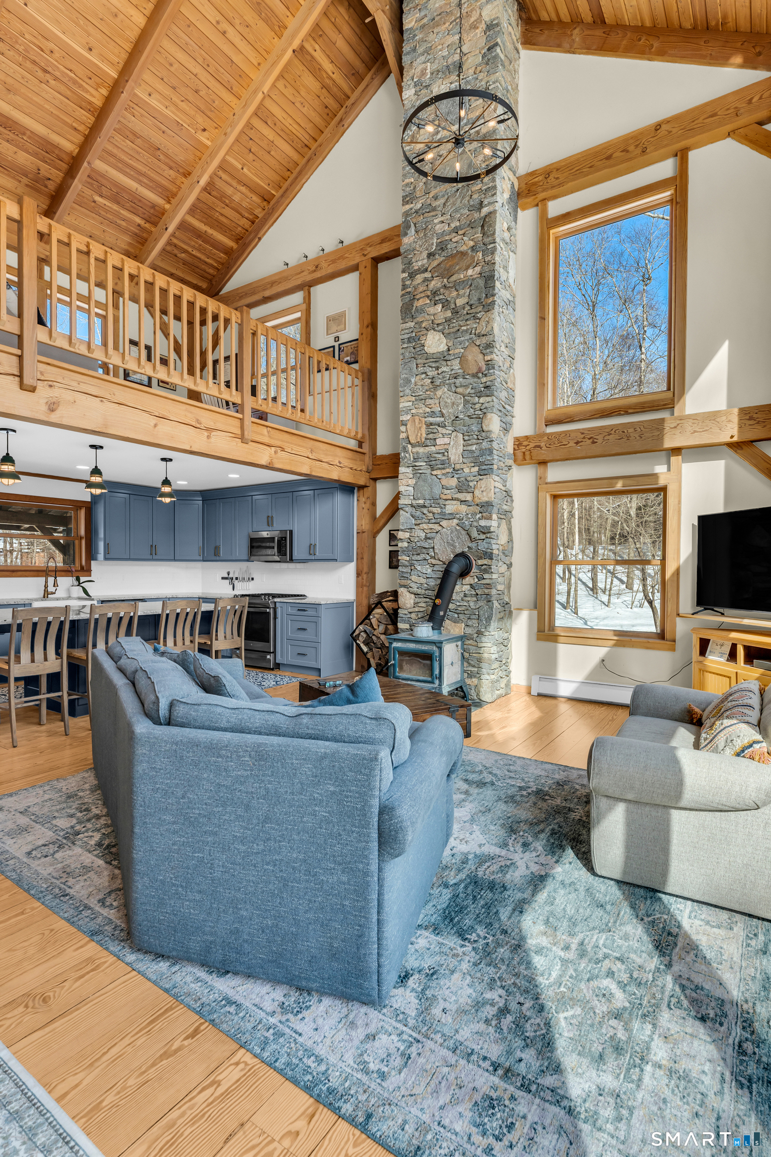167 Round Hill Road Salem, CT 06420 - Photo 17 of 48 a living room with furniture and a flat screen tv