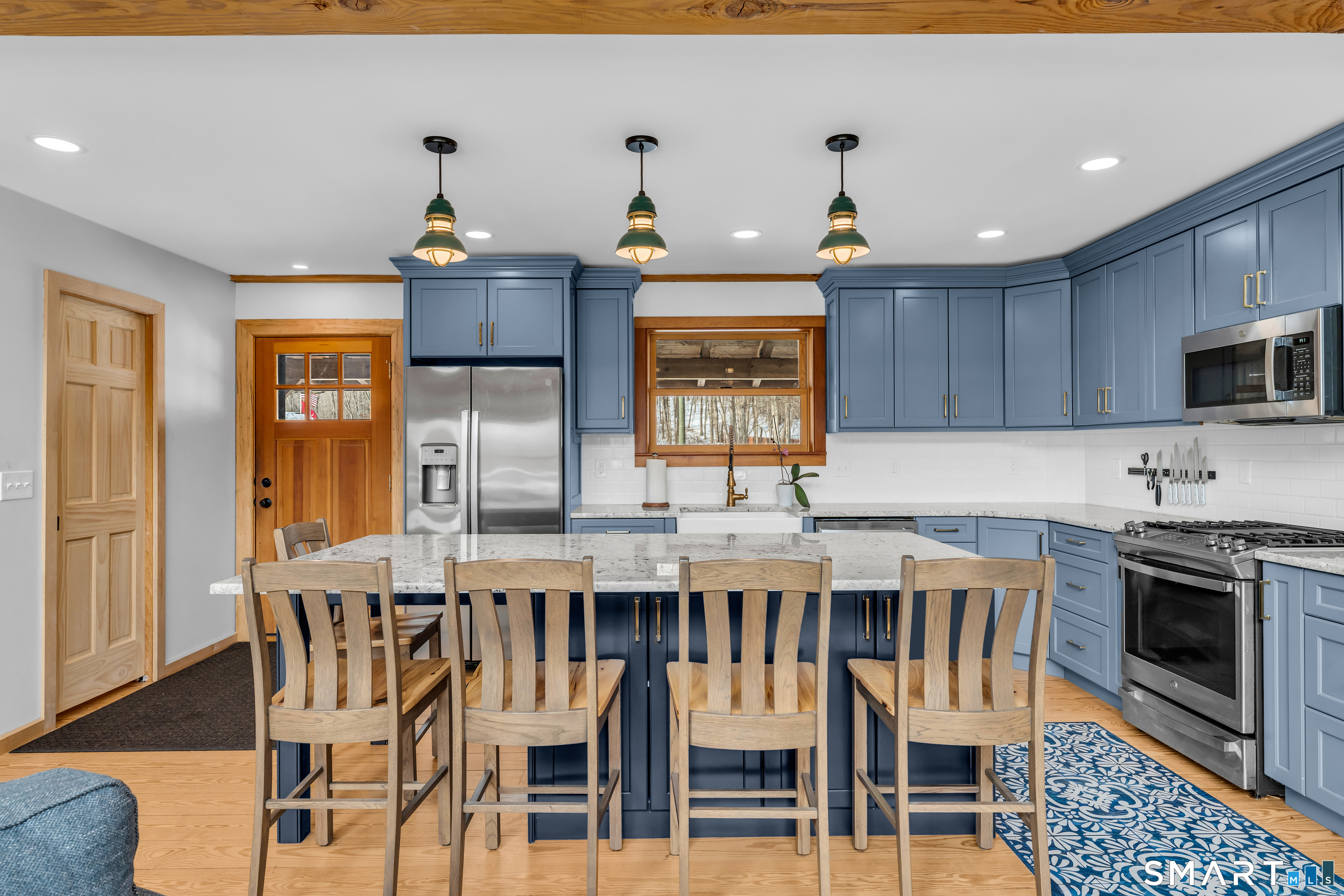 167 Round Hill Road Salem, CT 06420 - Photo 24 of 48 a kitchen with cabinets wooden floor and stainless steel appliances