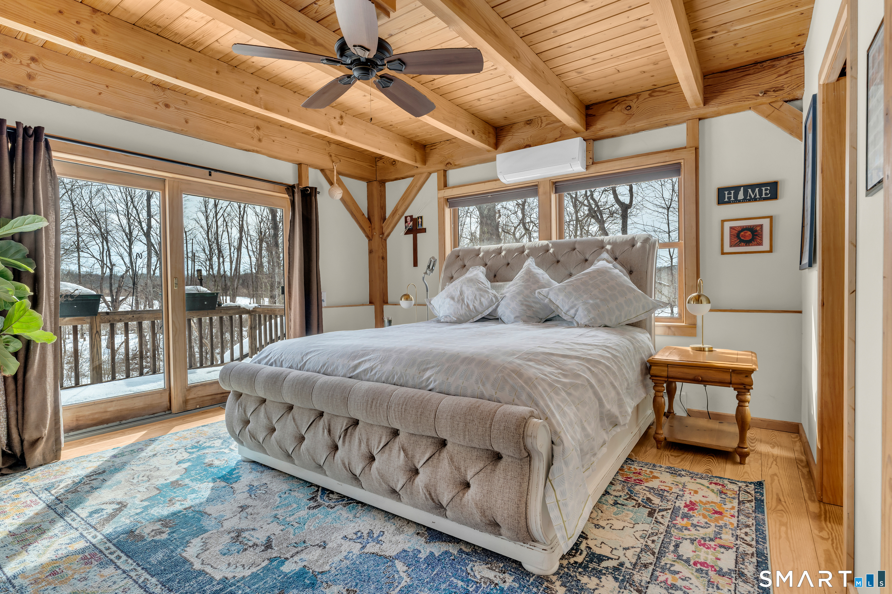 167 Round Hill Road Salem, CT 06420 - Photo 29 of 48 a bedroom with a large bed and a chandelier