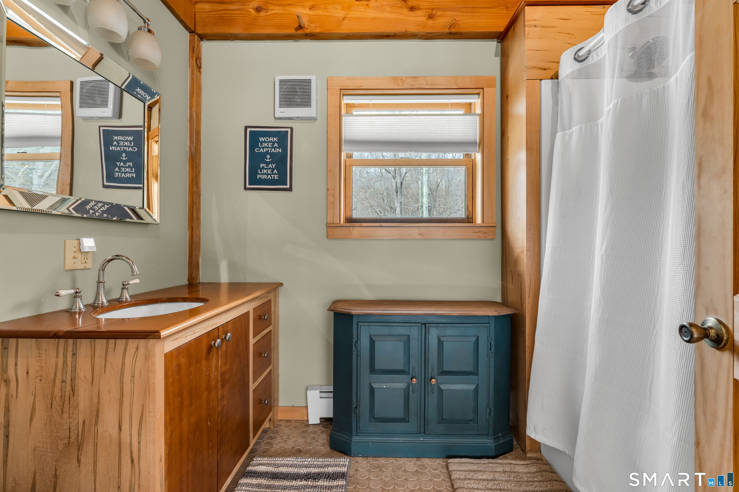 167 Round Hill Road Salem, CT 06420 - Photo 42 of 48 a bathroom with a sink a mirror and a shower