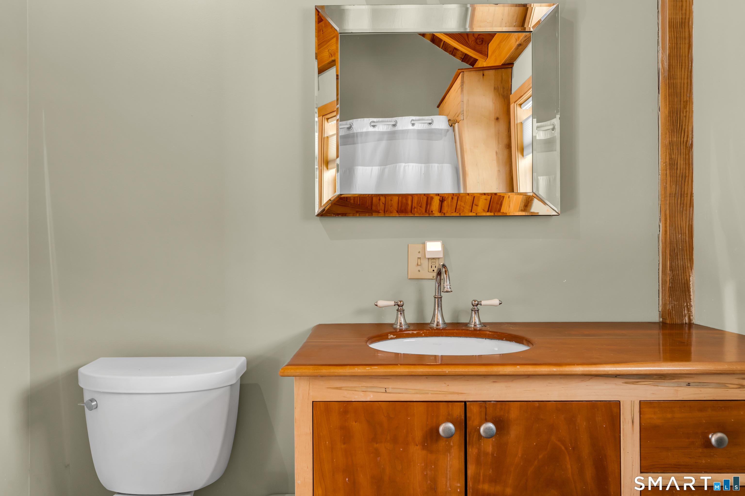 167 Round Hill Road Salem, CT 06420 - Photo 43 of 48 a bathroom with a sink and a mirror