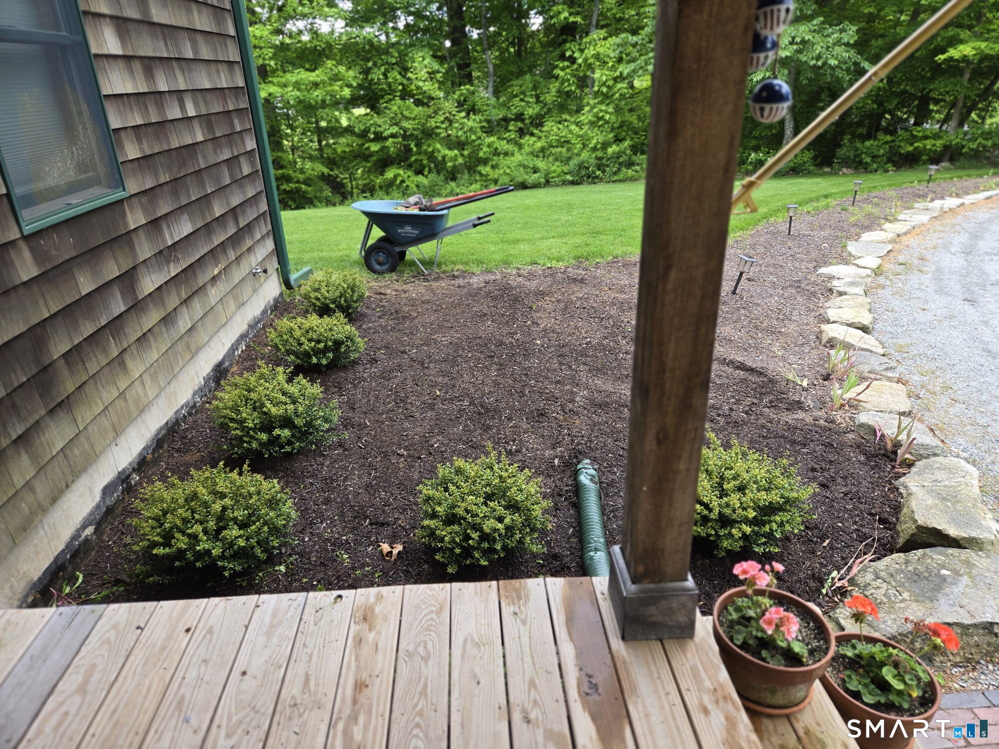 167 Round Hill Road Salem, CT 06420 - Photo 5 of 48 a view of a backyard with potted plants