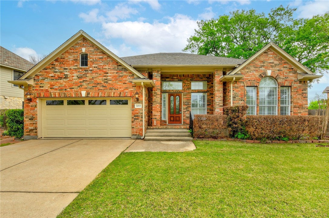 14801 Thatcher Drive Austin, TX 78717 - Photo 1 of 1 a front view of a house with a yard