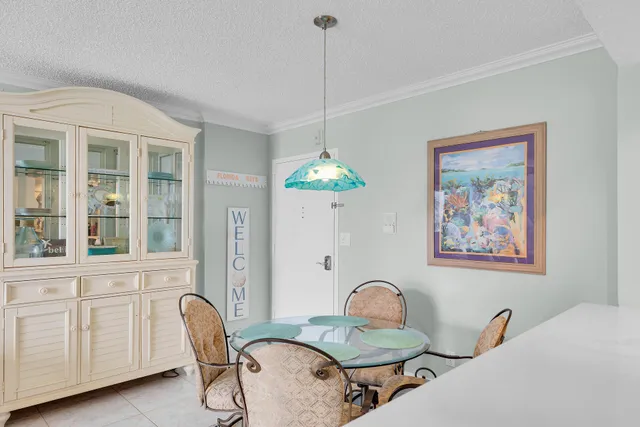 a living room with furniture a table and chair