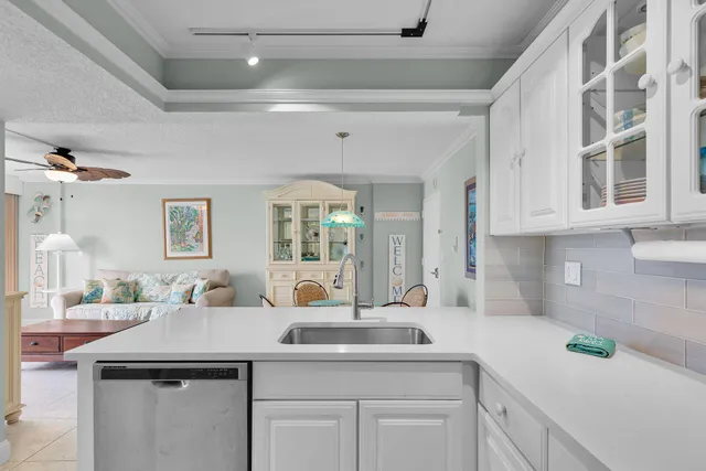a kitchen with a sink and cabinets