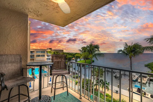 a view of a balcony with chairs