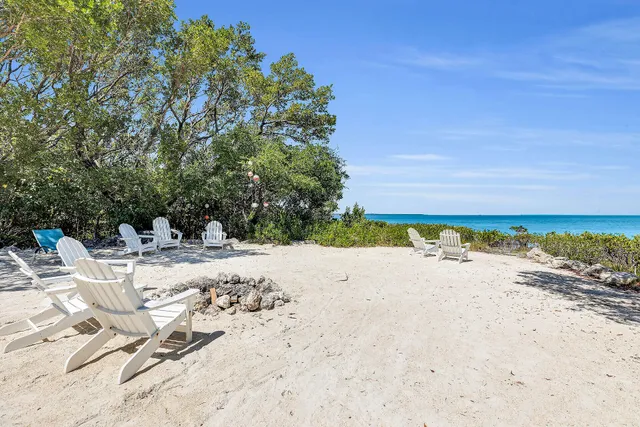 a view of a lounge chair on the beach