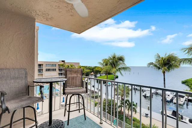 a view of a balcony with chairs