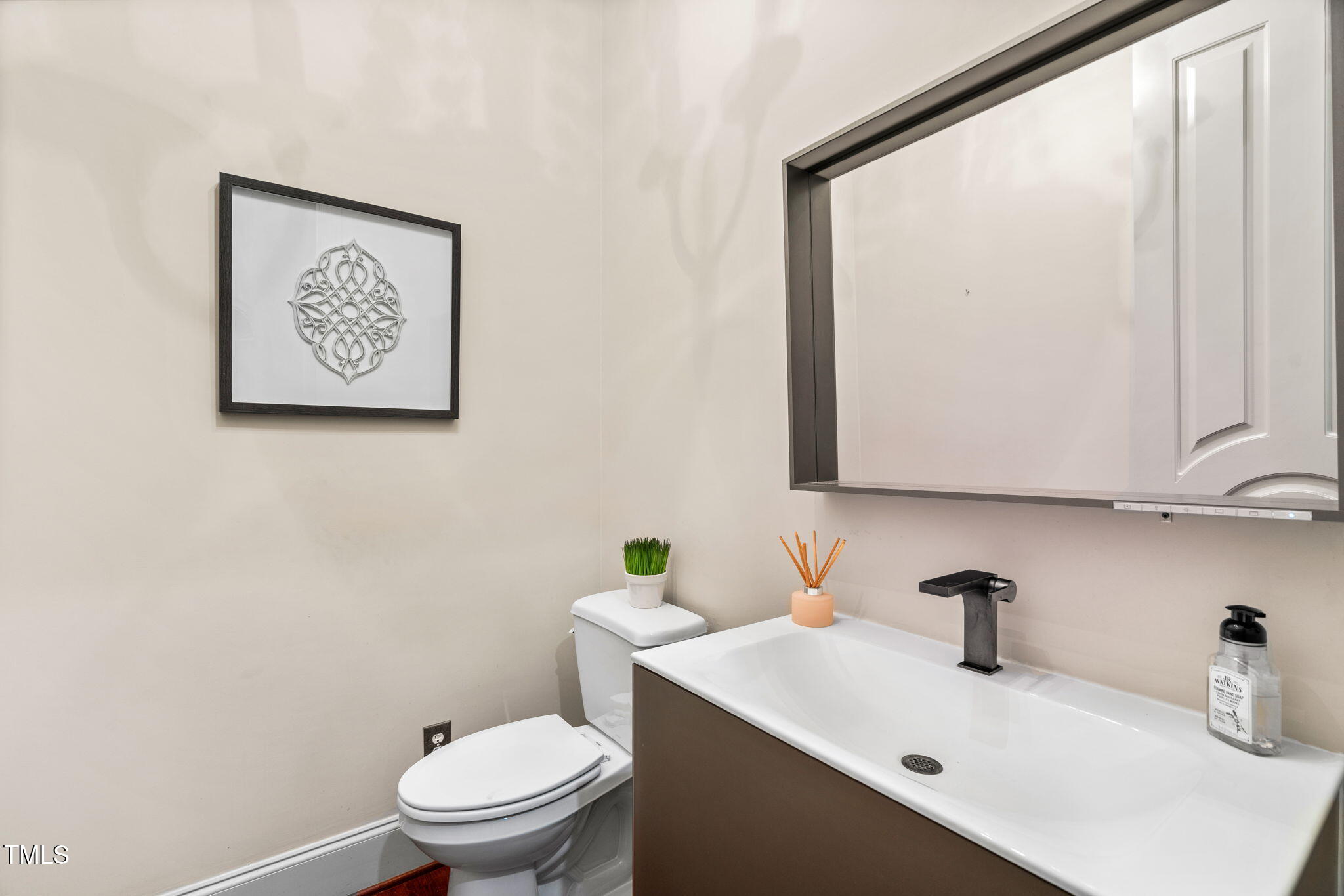 11201 Jonas Ridge Lane Raleigh, NC 27613 - Photo 39 of 79 Updated Powder room vanity, lighted mirror and faucet (2021)