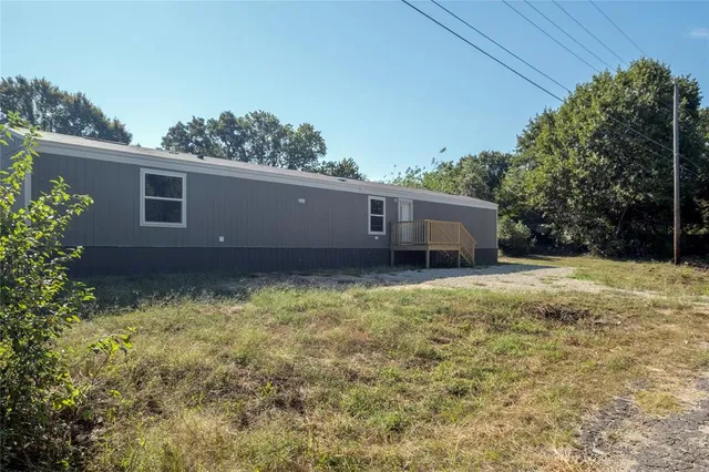 a house view with a garden space