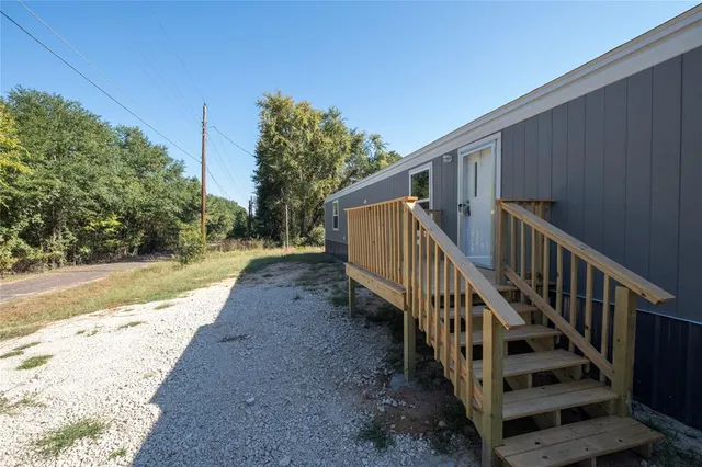 a view of a house with wooden stairs