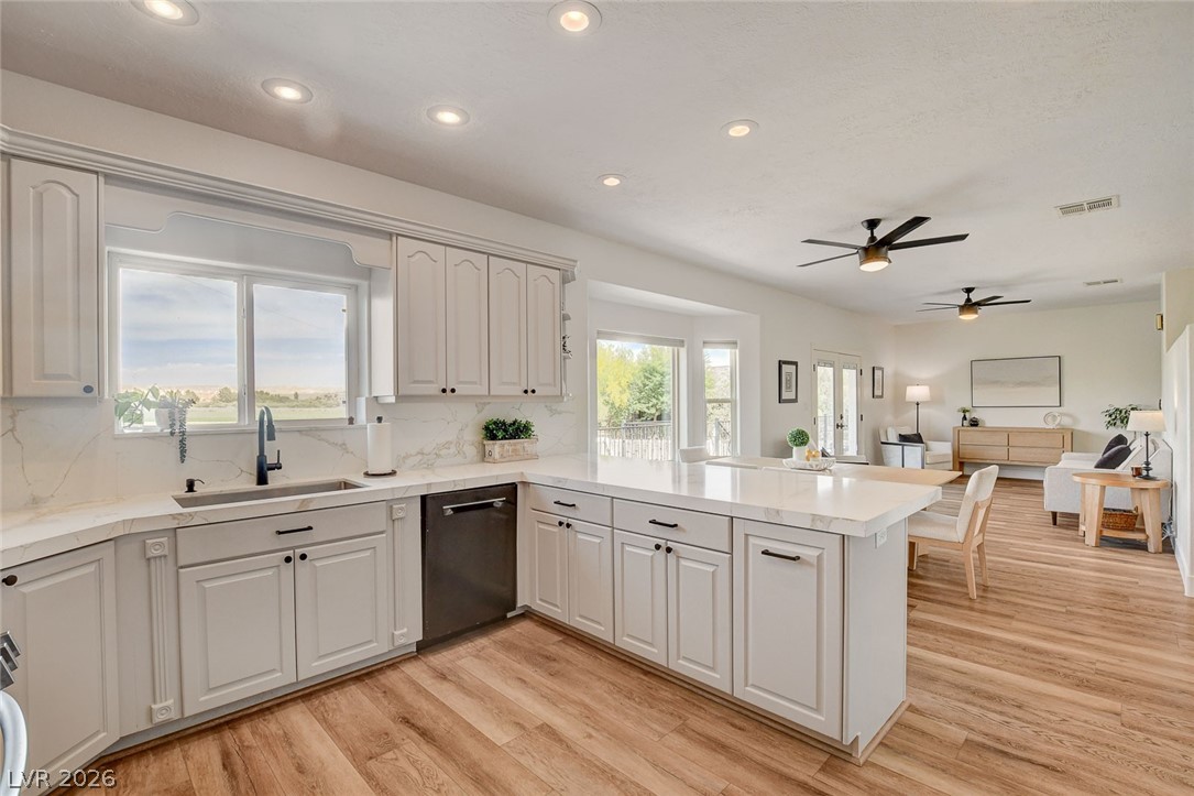 4362 Thistle Street Logandale, NV 89021 - Photo 23 of 99 Culinary aspirations meet design in this bright kitchen with modern amenities and an engaging view.