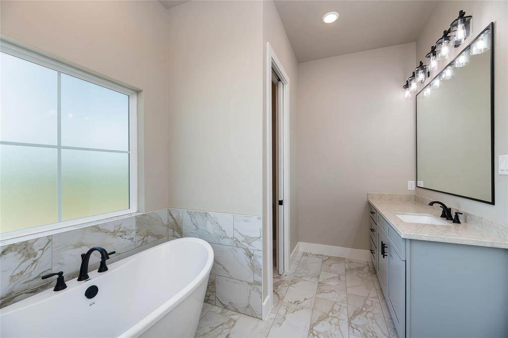 217 Fm 2258 Venus, TX 76084 - Photo 24 of 36 a bathroom with a sink and a tub
