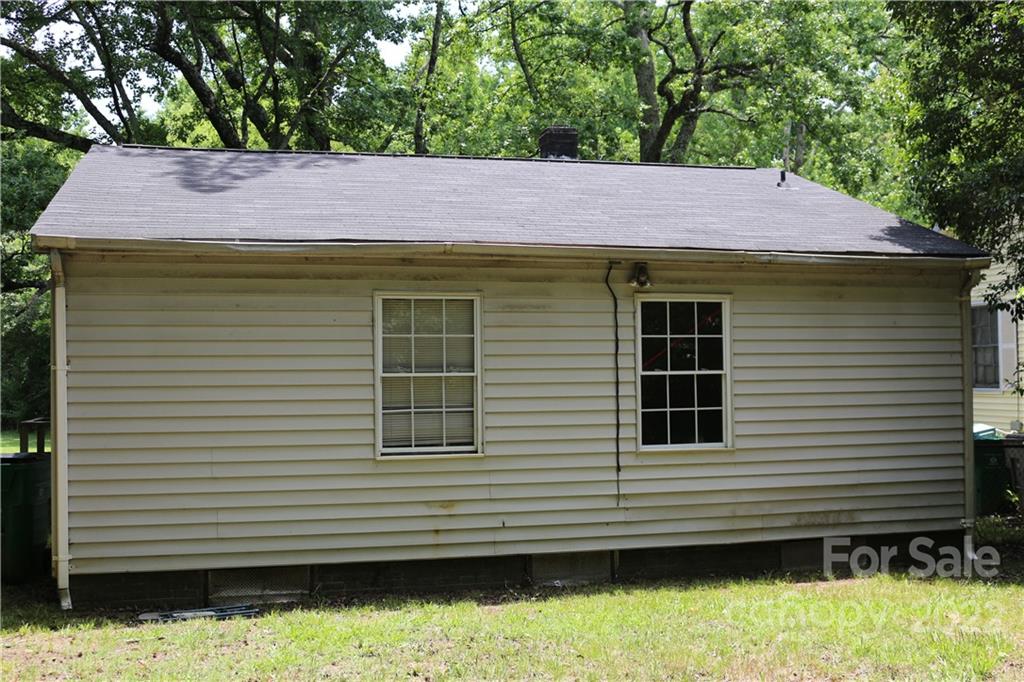 900 Key Street Charlotte, NC 28208 - Photo 3 of 3 a small white house with a wooden fence
