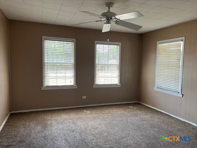 208 Sample Street Edna, TX 77957 - Photo 9 of 10 a view of room with a ceiling fan and window
