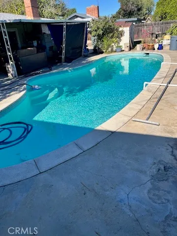 a view of a backyard with furniture