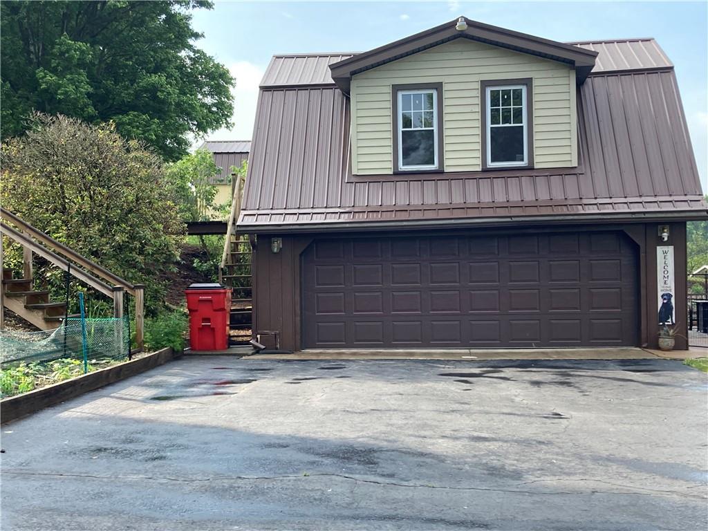 26 Paxton Road Sandy Lake, PA 16145 - Photo 5 of 23 a view of a house with a garage