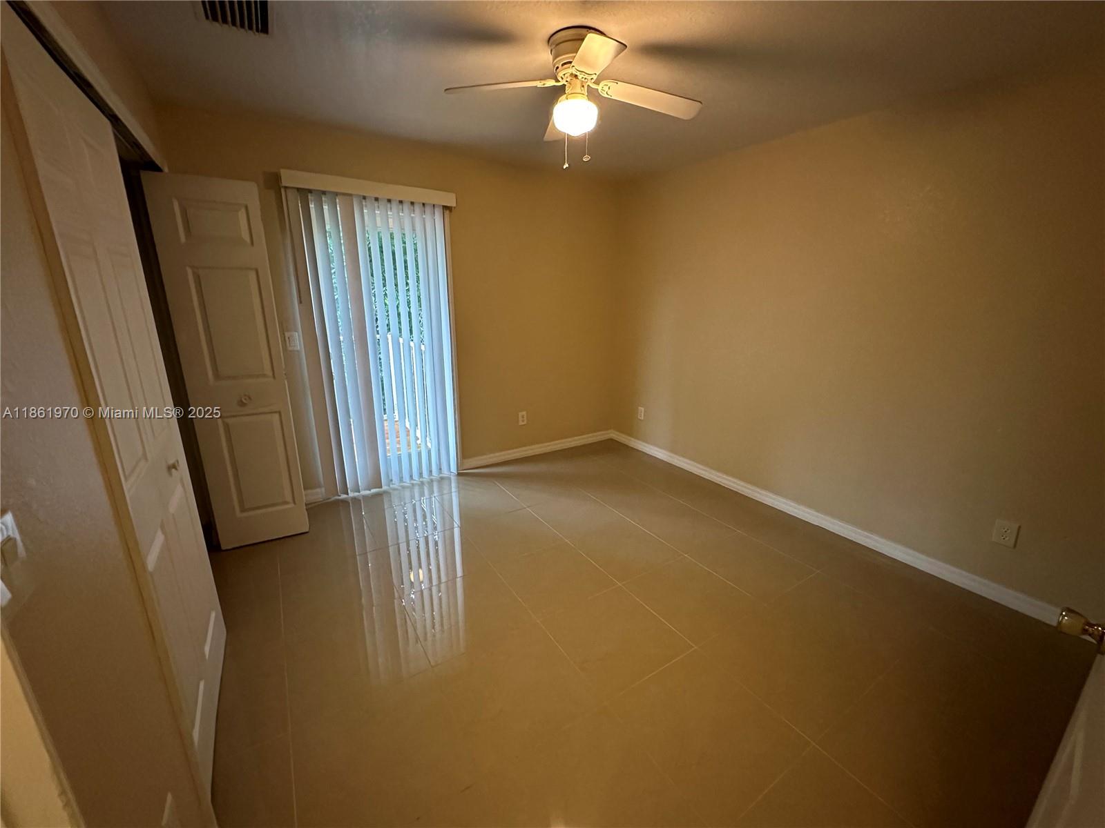5548 Birdsong Lane, Unit 1 Bokeelia, FL 33922 - Photo 12 of 24 wooden floor in an empty room