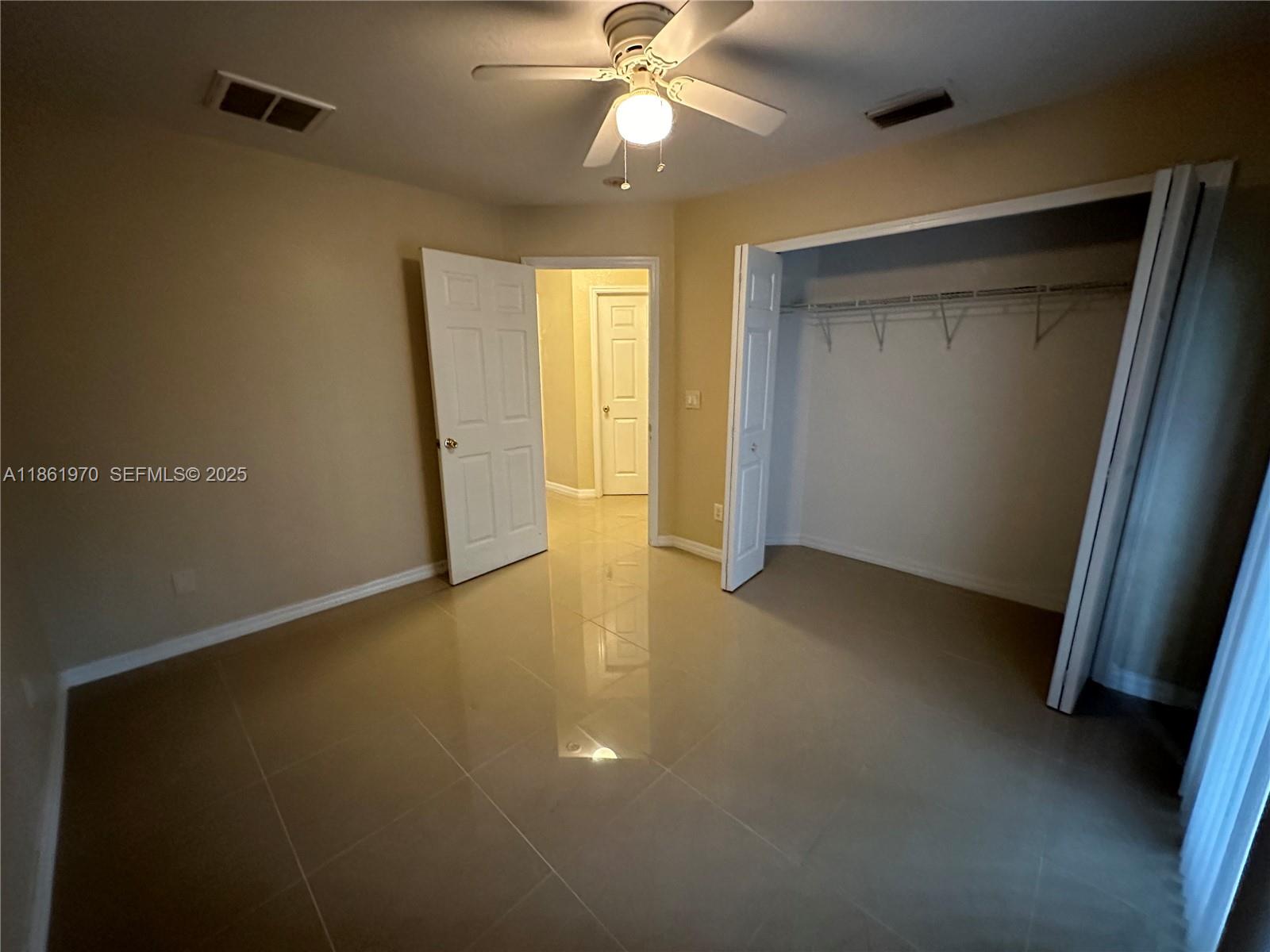 5548 Birdsong Lane, Unit 1 Bokeelia, FL 33922 - Photo 14 of 24 a view of an empty room with a window