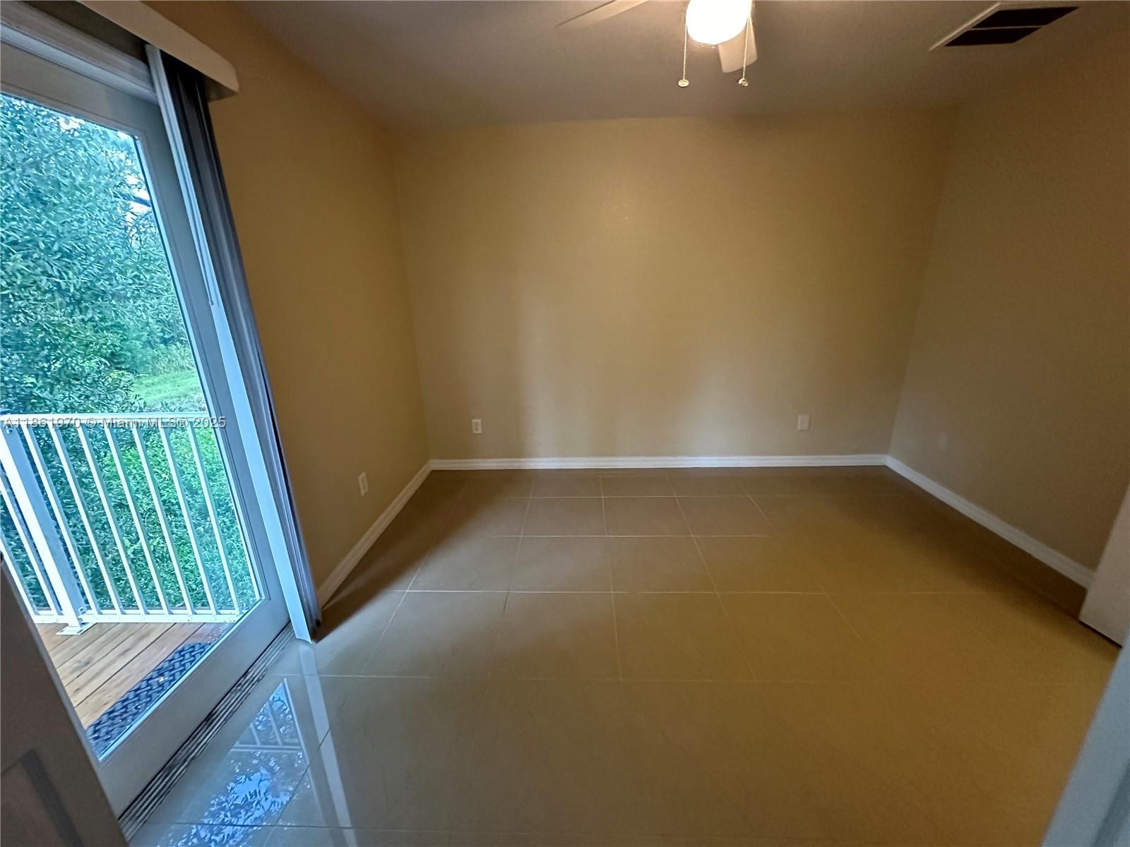 5548 Birdsong Lane, Unit 1 Bokeelia, FL 33922 - Photo 15 of 24 a view of an empty room with a window