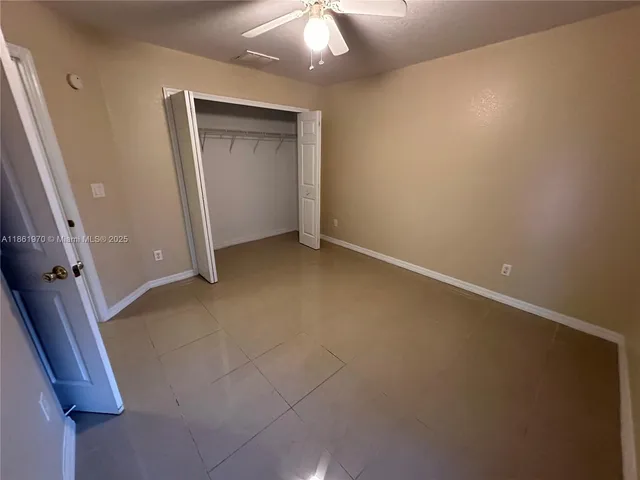 an empty room with a bathroom