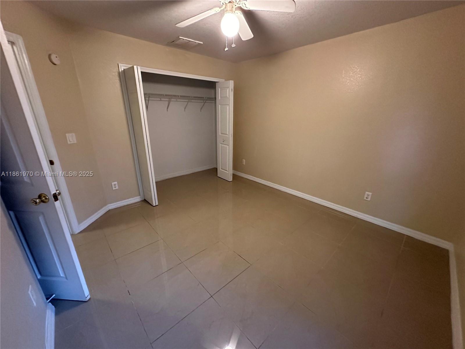 5548 Birdsong Lane, Unit 1 Bokeelia, FL 33922 - Photo 18 of 24 an empty room with a bathroom