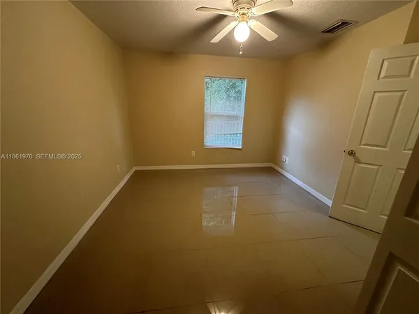 a bathroom with a sink a toilet a mirror and shower