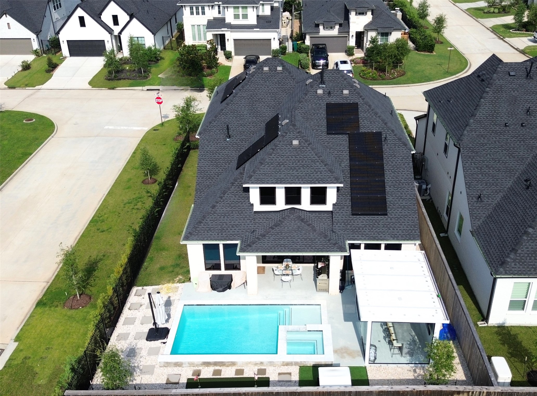 26918 Swanborough Road Spring, TX 77389 - Photo 3 of 50 This incredible property sits on a spacious corner lot, where solar panels crown the roofline and a private backyard oasis — complete with pool, spa, and putting green — awaits below.