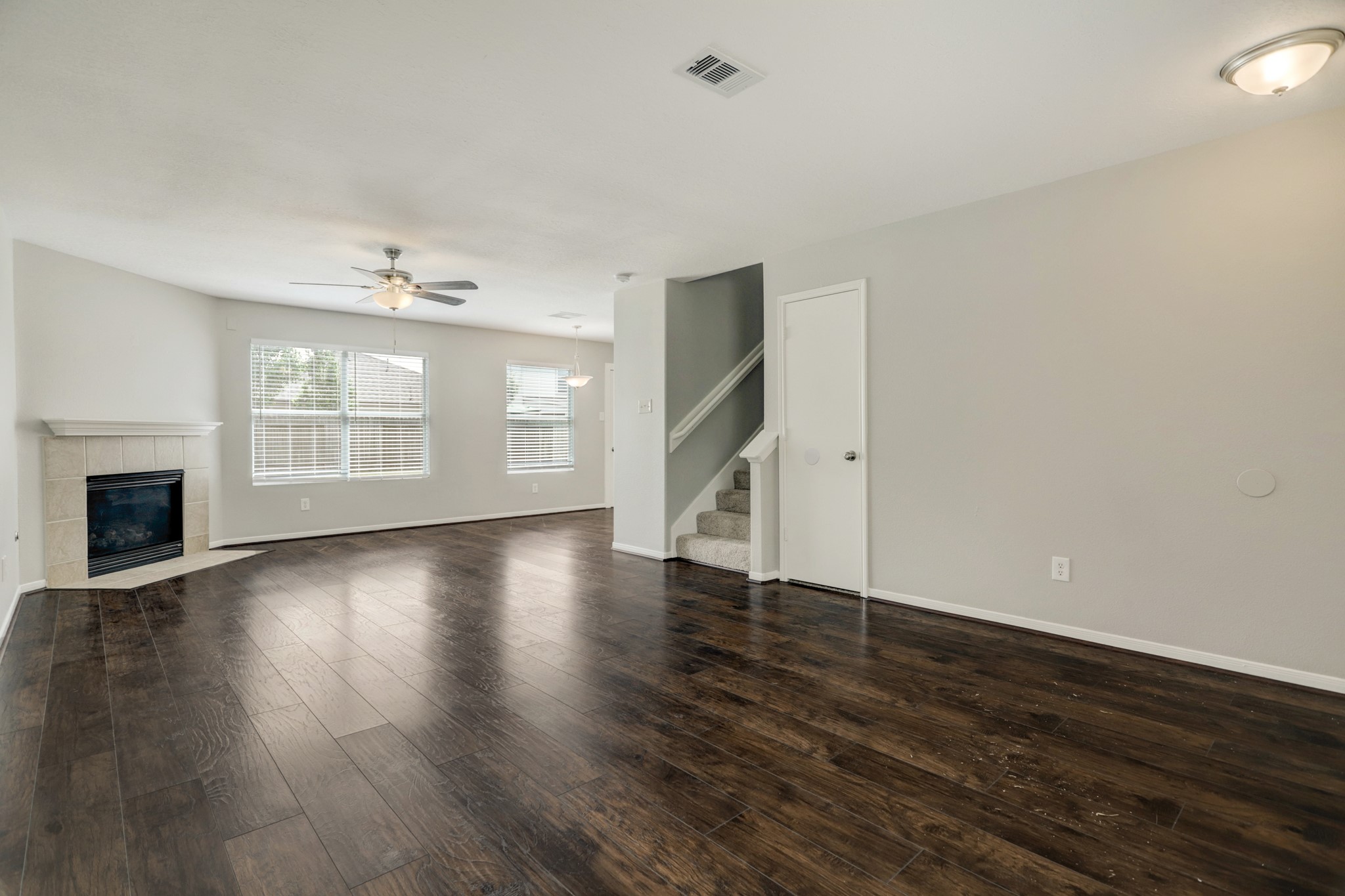 5014 Mabry Stream Court Katy, TX 77449 - Photo 2 of 13 a view of an empty room with wooden floor and a window