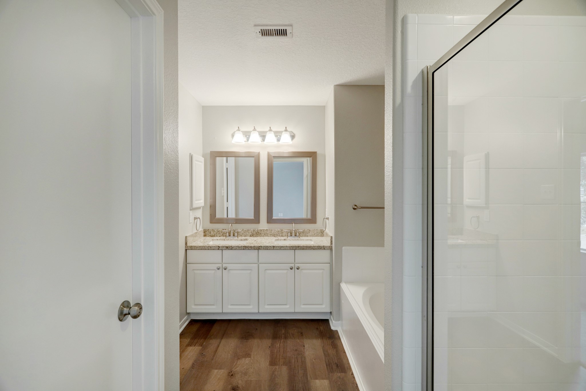 5014 Mabry Stream Court Katy, TX 77449 - Photo 6 of 13 a bathroom with a double vanity sink and mirror