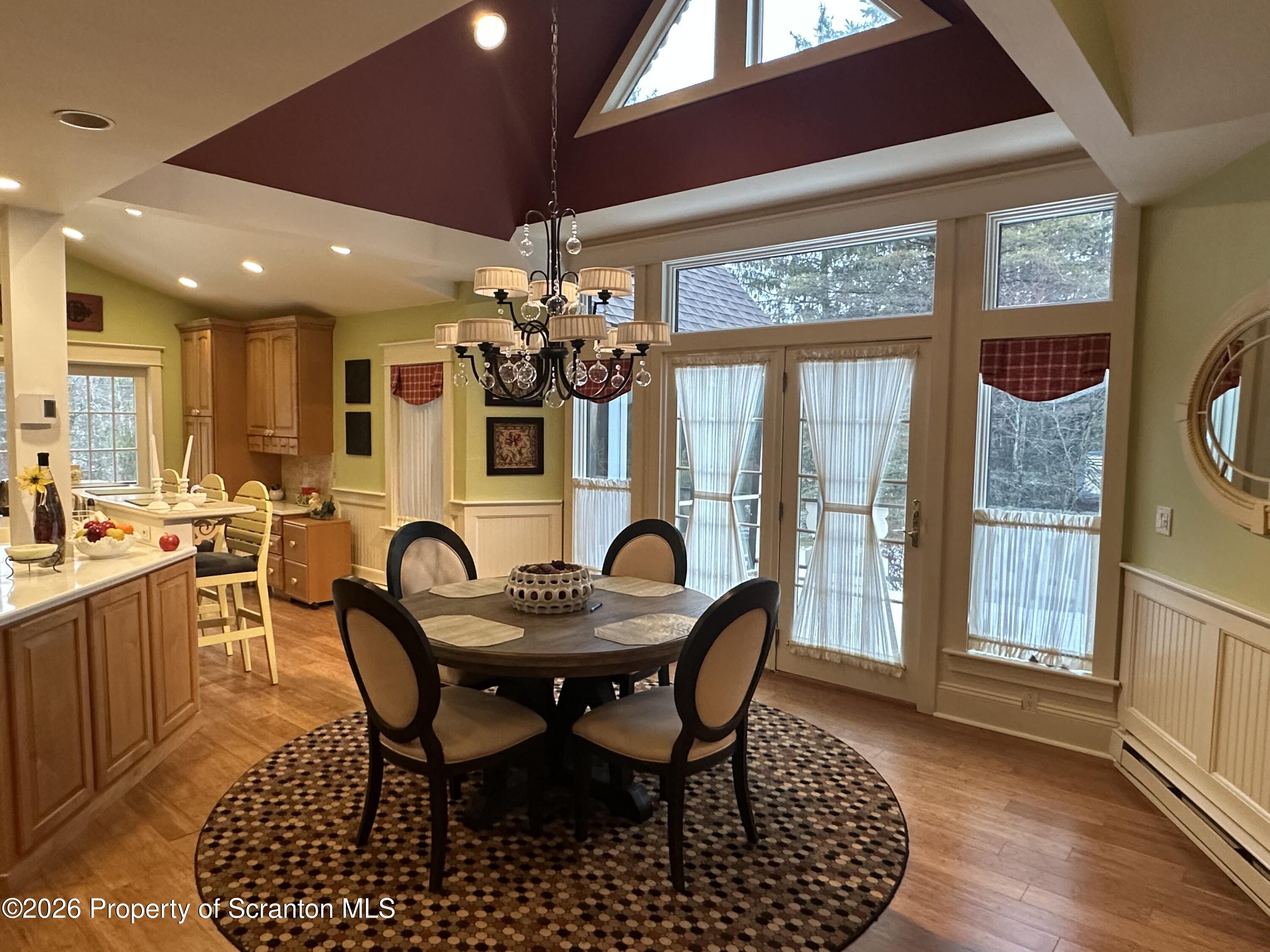 15 Fall Place Union Dale, PA 18470 - Photo 11 of 35 a dining room with furniture a chandelier and wooden floor