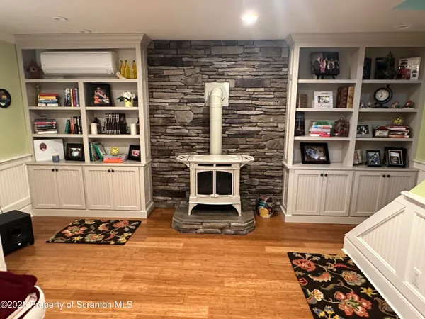 a bedroom with furniture and a chandelier