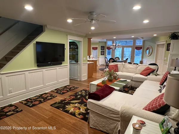 a bathroom with a toilet a sink and a window