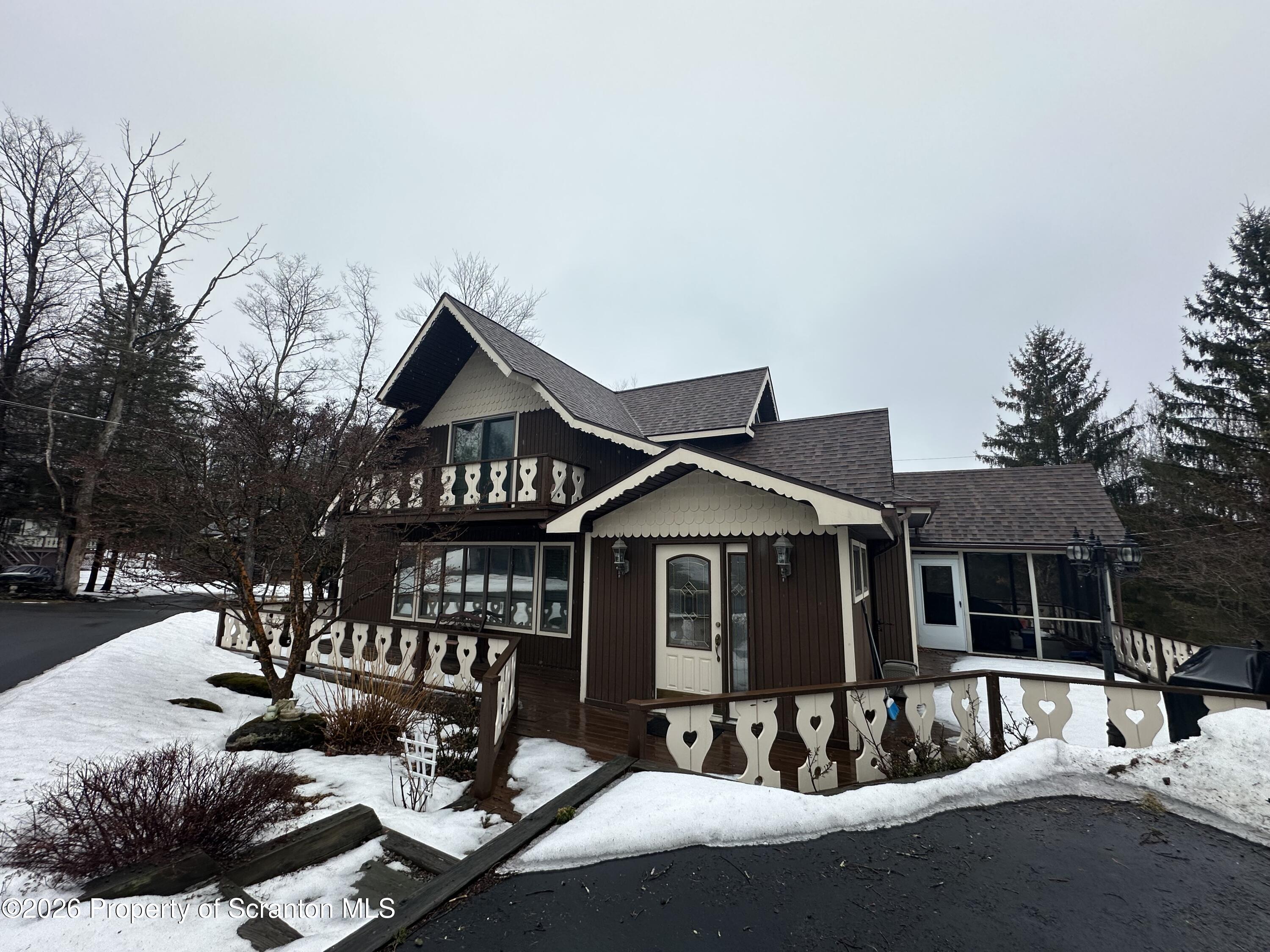 15 Fall Place Union Dale, PA 18470 - Photo 2 of 35 a front view of a house with yard outdoor seating and barbeque oven