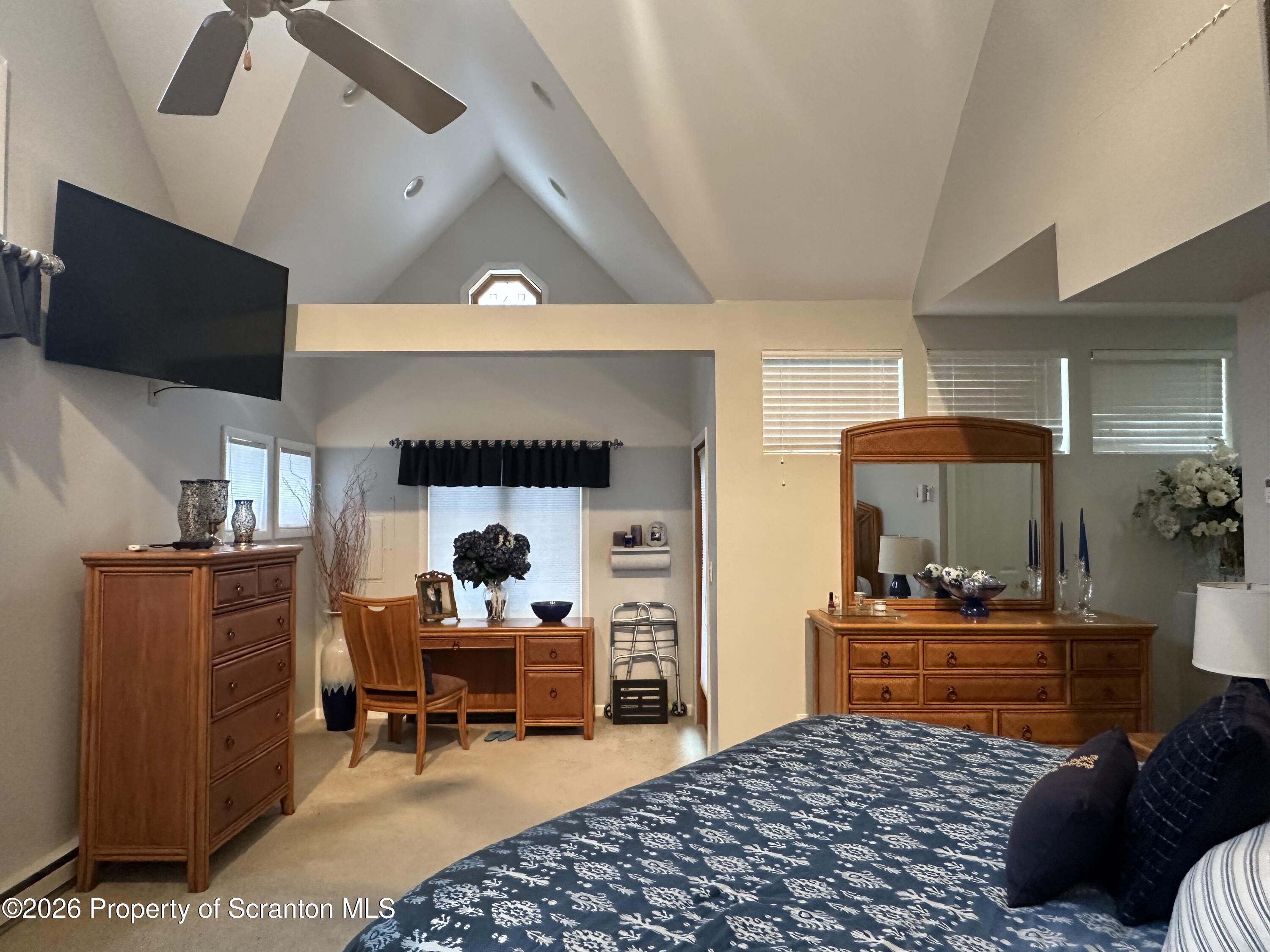 15 Fall Place Union Dale, PA 18470 - Photo 23 of 35 a bedroom with furniture and a chandelier