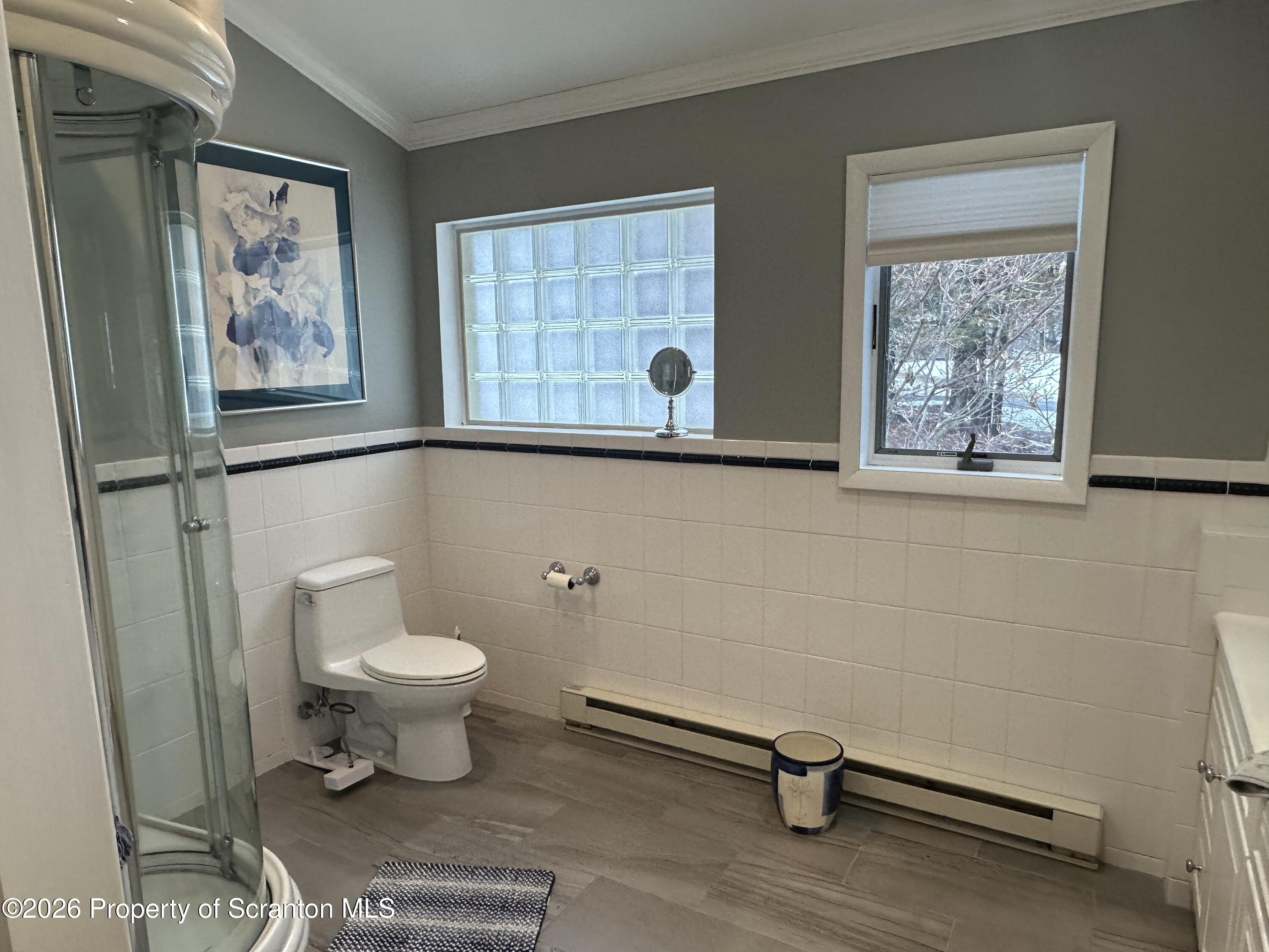 15 Fall Place Union Dale, PA 18470 - Photo 25 of 35 a bathroom with a toilet a sink and a window