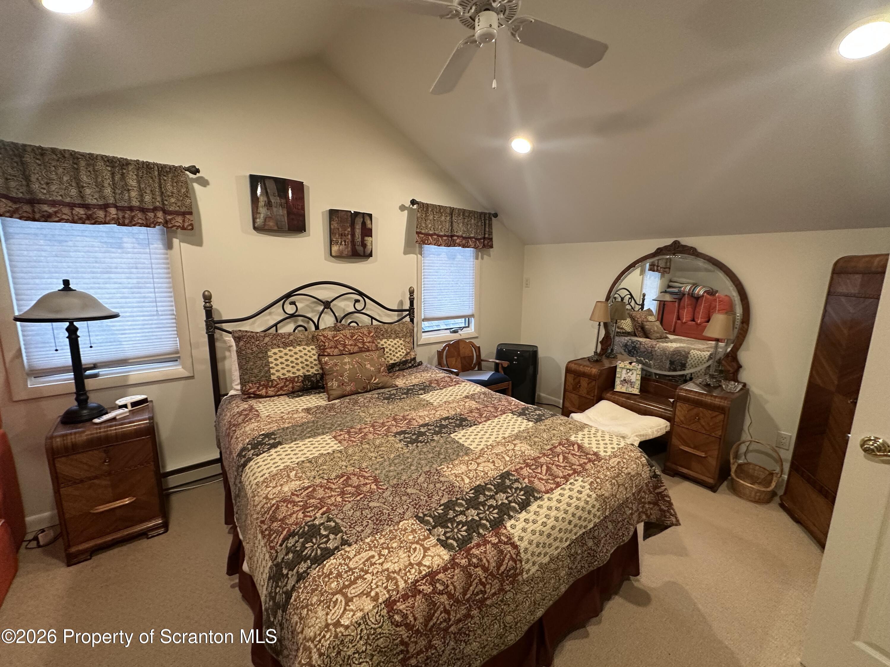15 Fall Place Union Dale, PA 18470 - Photo 35 of 35 a bedroom with a bed a dresser and potted plants