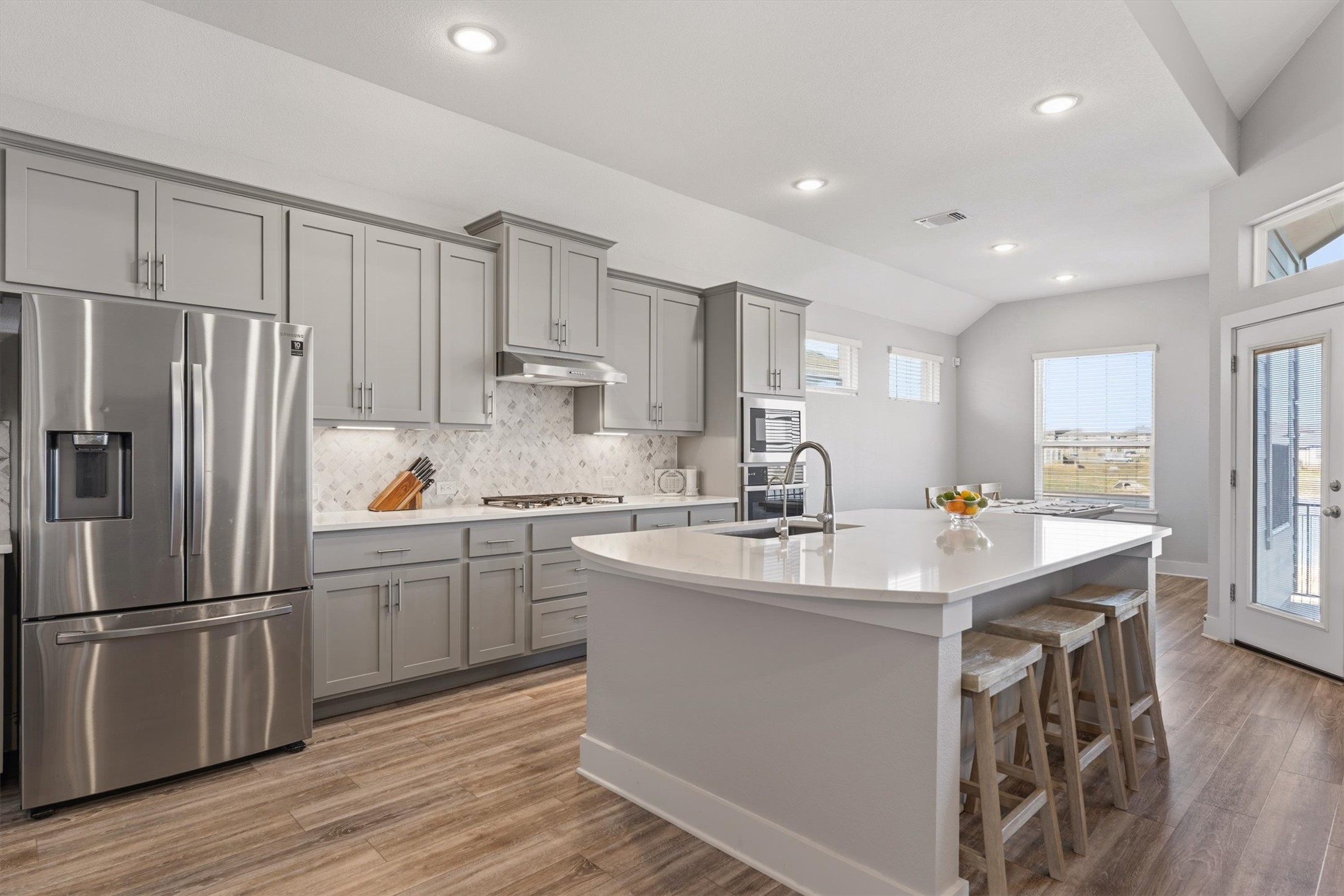 20900 Claire Jean Path Pflugerville, TX 78660 - Photo 8 of 35 a kitchen with refrigerator cabinets and a sink