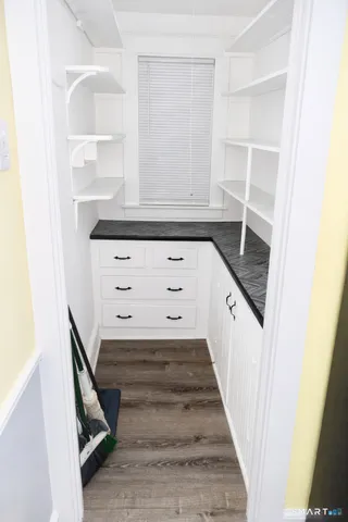 a view of a hallway with closet
