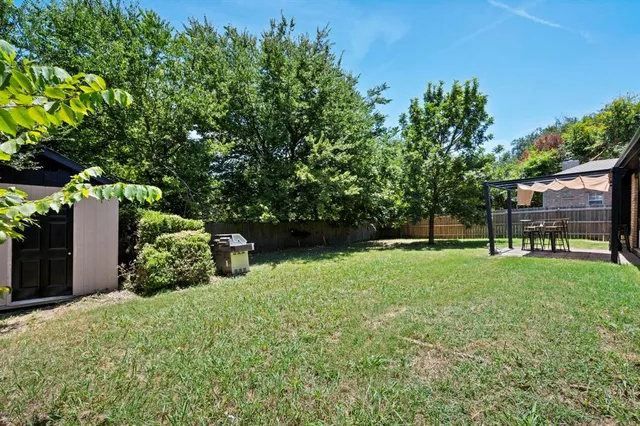 a backyard of a house with lots of green space