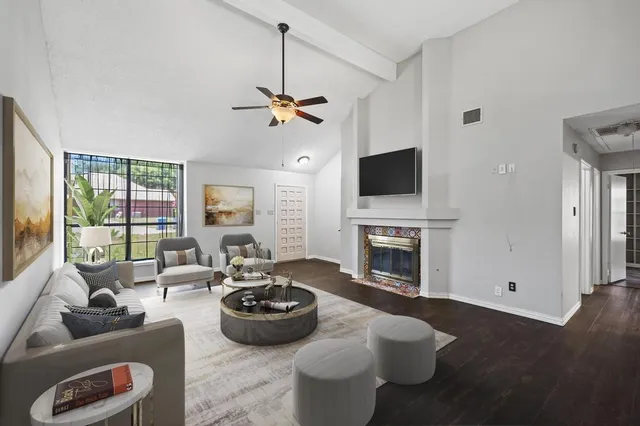 a living room with furniture fireplace and a flat screen tv