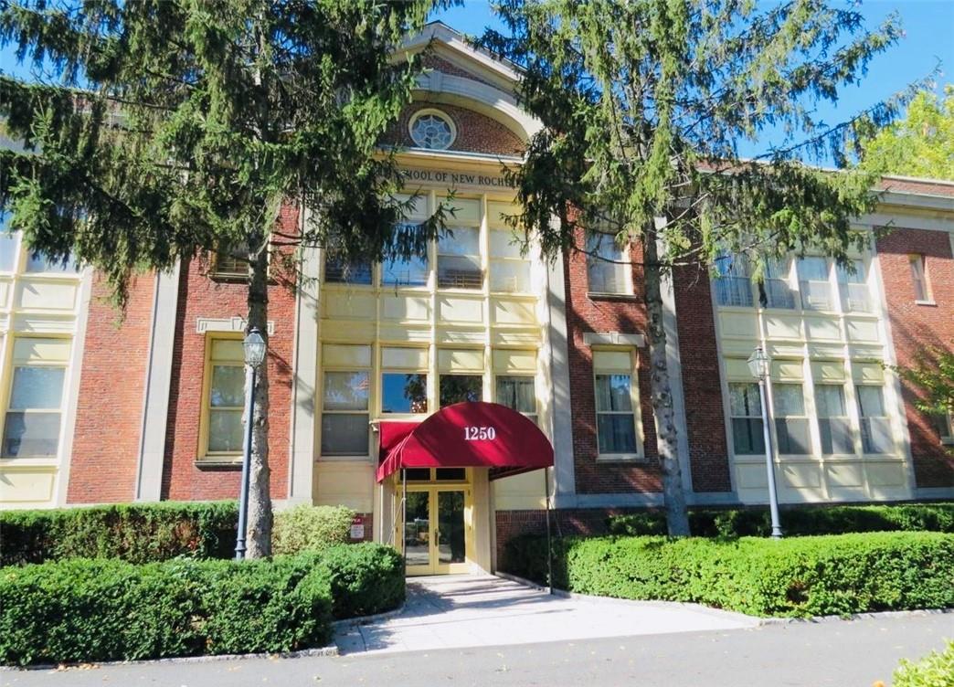 1250 North Avenue New Rochelle, NY 10804 - Photo 1 of 1 a front view of a house with a yard and tree s