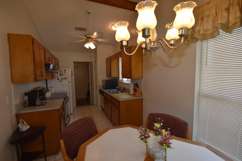 2840 Old Mill Way Crestview, FL 32539 - Photo 14 of 35 a kitchen with a sink appliances and cabinets