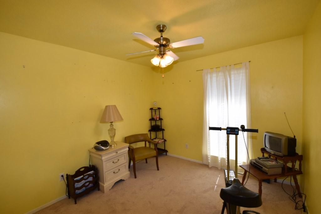 2840 Old Mill Way Crestview, FL 32539 - Photo 24 of 35 a view of a workspace with furniture and a ceiling fan