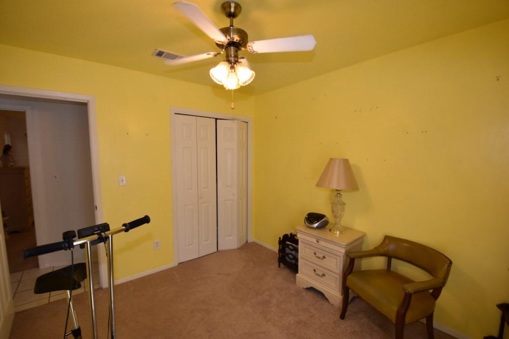 2840 Old Mill Way Crestview, FL 32539 - Photo 25 of 35 a bed room with a bed and a chandelier