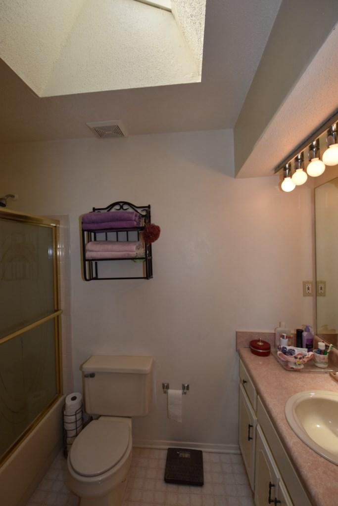 2840 Old Mill Way Crestview, FL 32539 - Photo 28 of 35 a bathroom with a toilet a sink and mirror